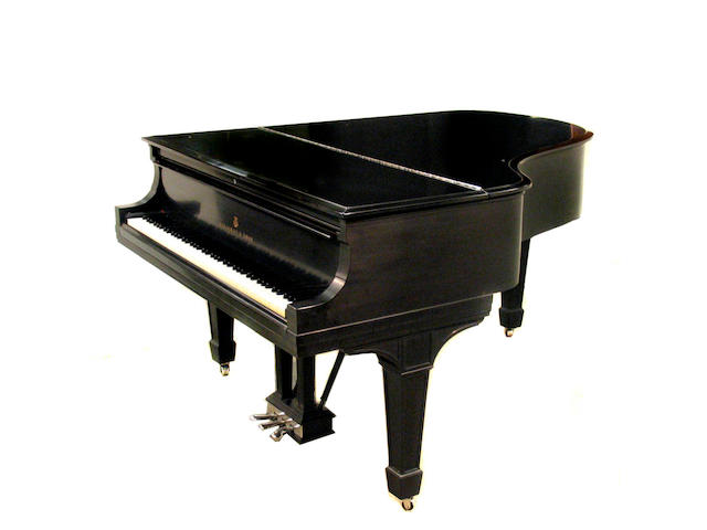 A Steinway & Sons ebonized grand piano and bench