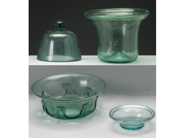 A grouping of aqua blown glass table articles