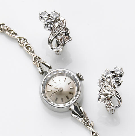 A lady's Certina, Swiss 14k white gold, stainless steel and diamond integral bracelet wristwatch, together with a pair of diamond, low karat white gold earrings