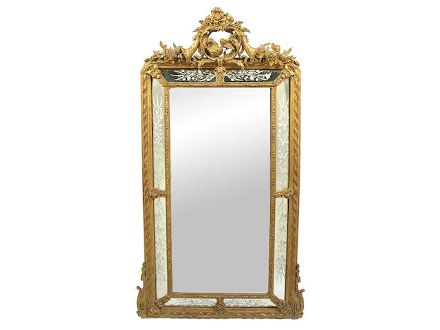 A Louis XVI style giltwood and composition mirror