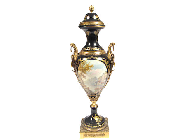 A large pair of porcelain and gilt bronze mounted urns