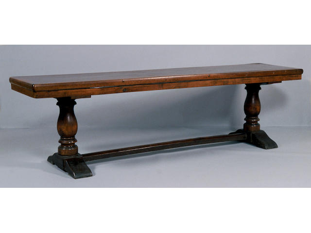 A Continental Baroque walnut refectory table