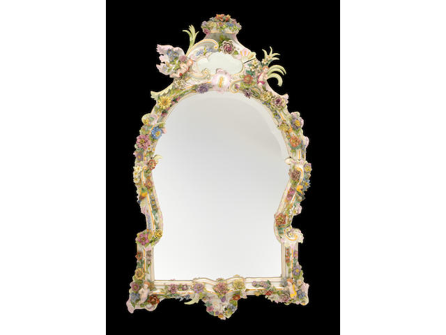 An imposing Continental porcelain mirror