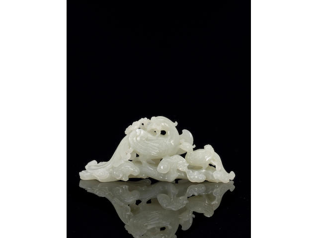 A fine and rare white jade brush rest of a phoenix and chick Qianlong