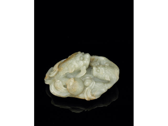 A greenish-white jade lion-dog group Late Ming Dynasty