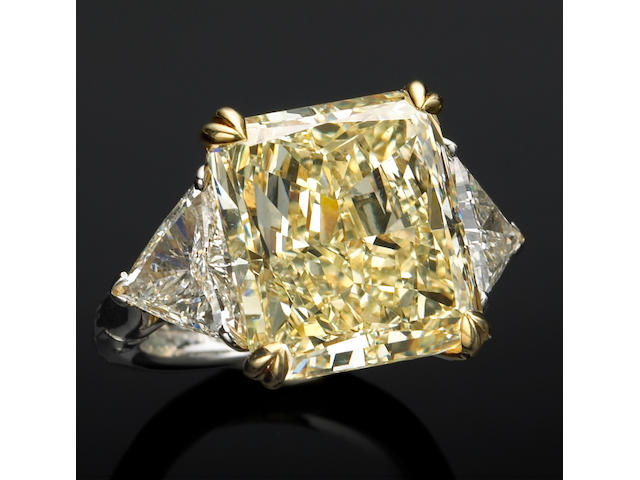 A natural color diamond, diamond, platinum and eighteen karat gold ring