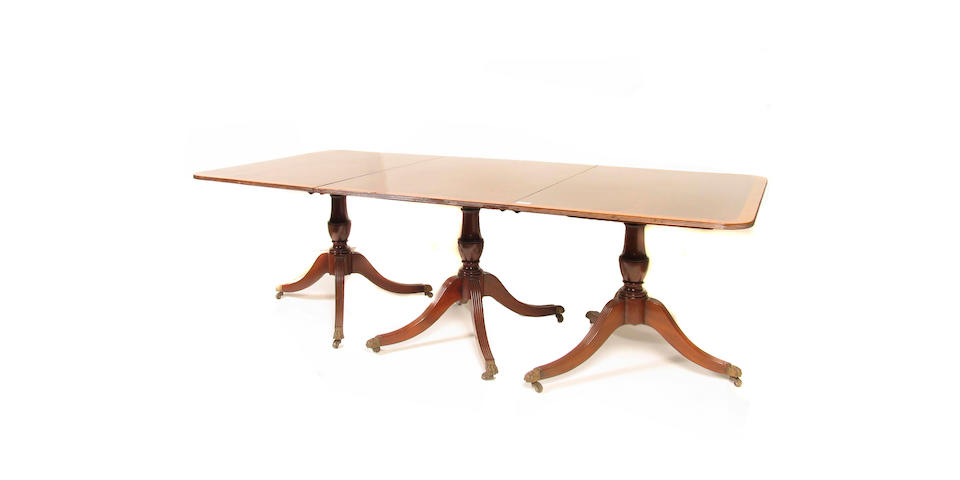 A Regency style three pedestal dining table