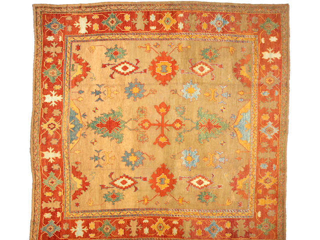 An Oushak carpet West Anatolia, size approximately 14ft. 8in. x 14ft. 6in.