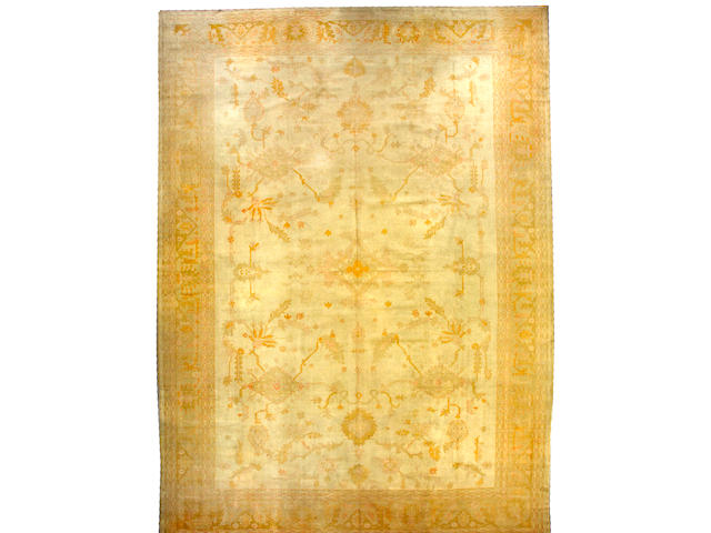 An Oushak carpet West Anatolia, size approximately 13ft. 7in. x 18ft. 7in.