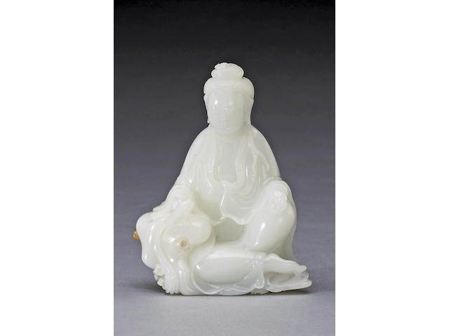 A white jade figure of Guanyin