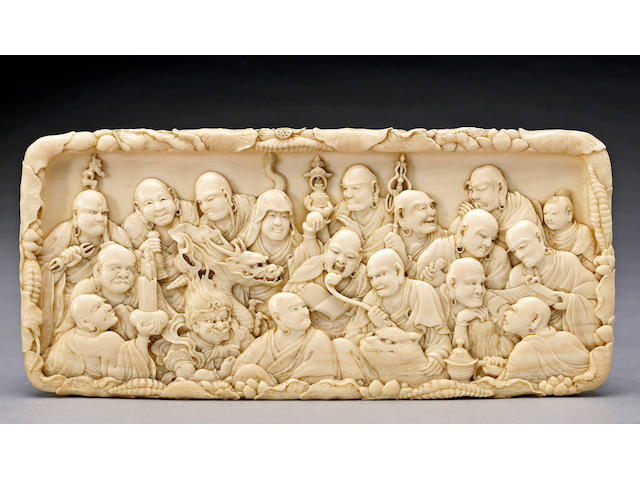 A fine ivory plaque depicting the eighteen rakan By Mitsutoshi, Meiji Period