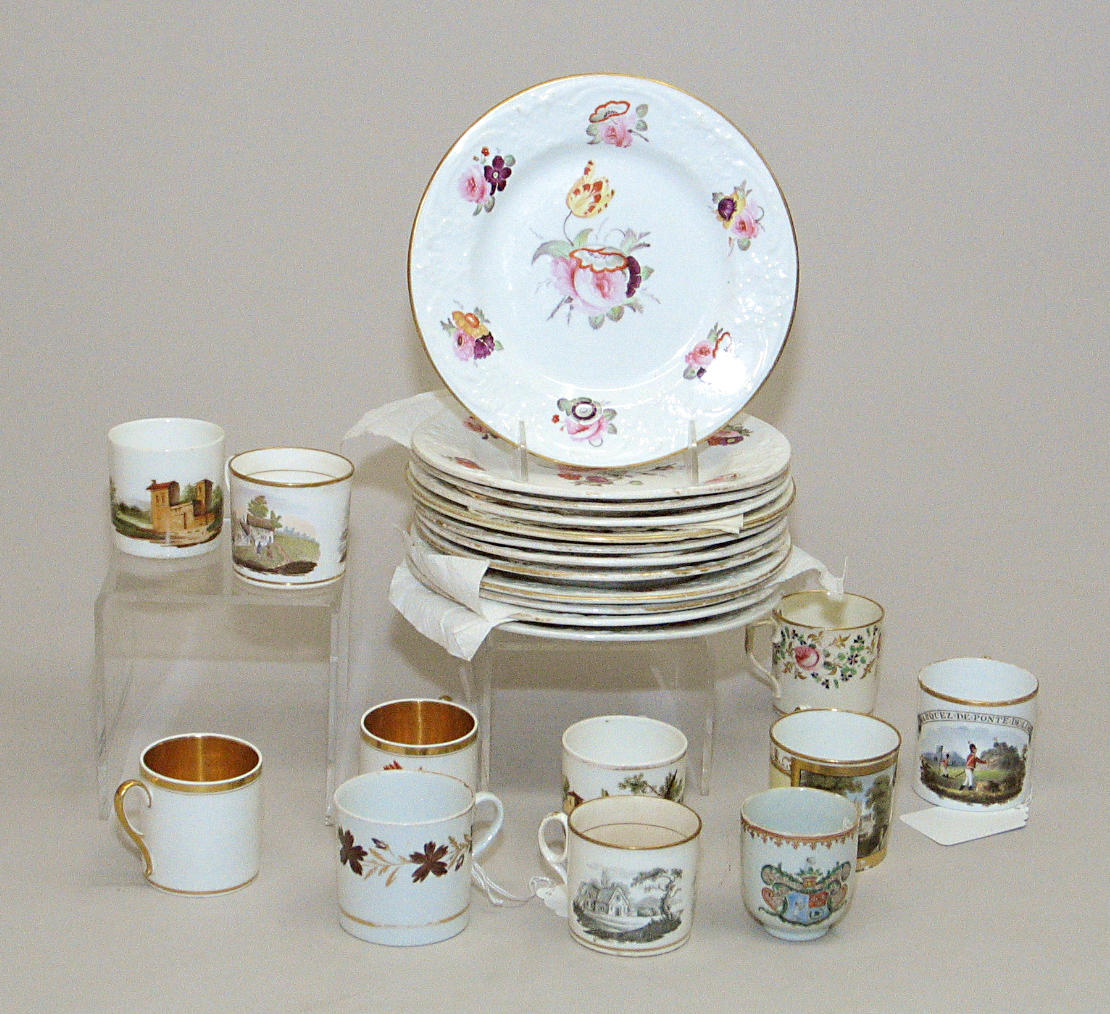 An assembled grouping of porcelain cups, saucers and plates