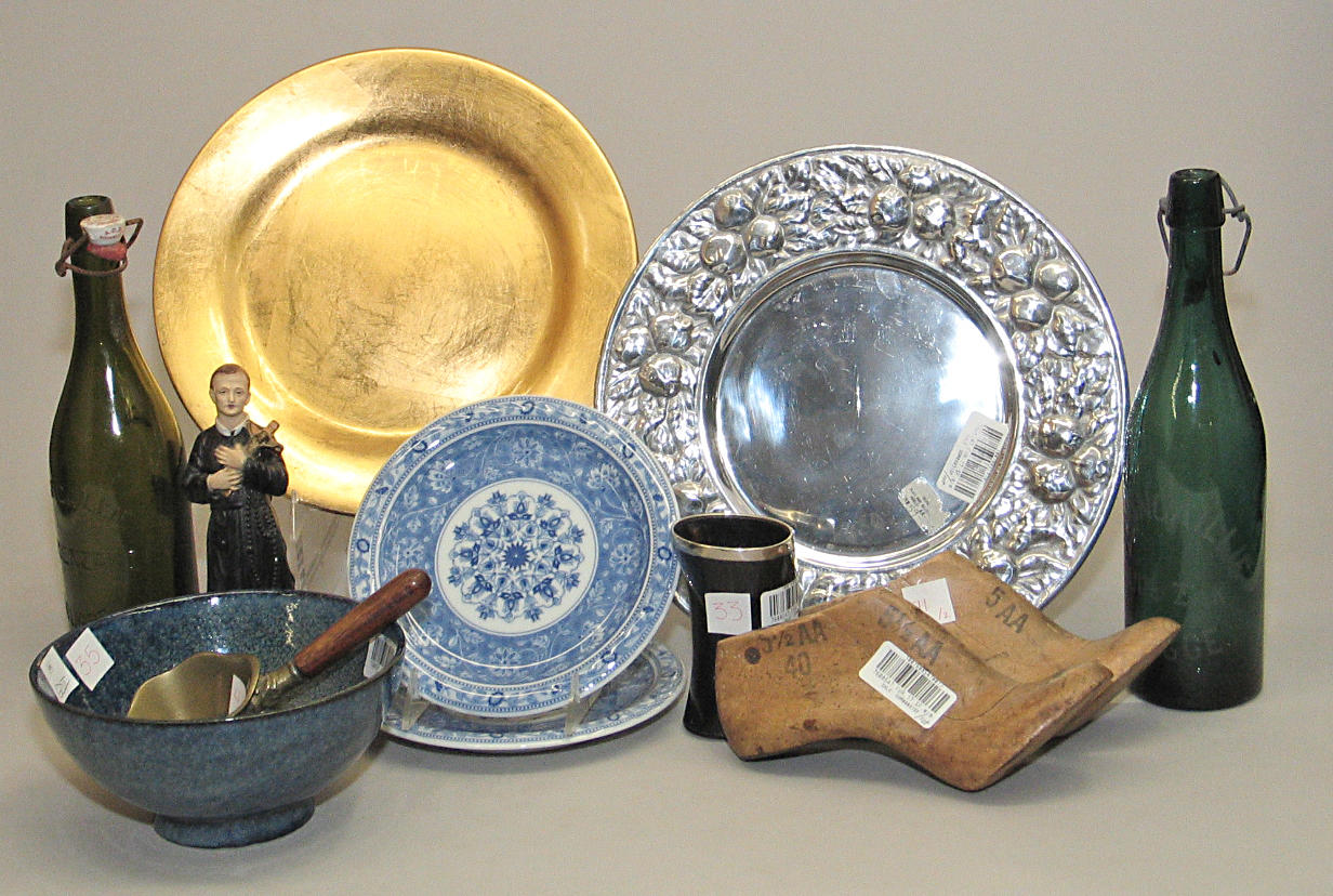 An assembled grouping of ceramic, glass, silverplate and various other mediums