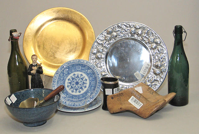 An assembled grouping of ceramic, glass, silverplate and various other mediums