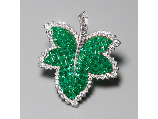 A rare emerald and diamond "Mystery Set" leaf brooch, French, Van Cleef & Arpels,
