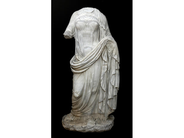 A carved marble figure of a classical maiden