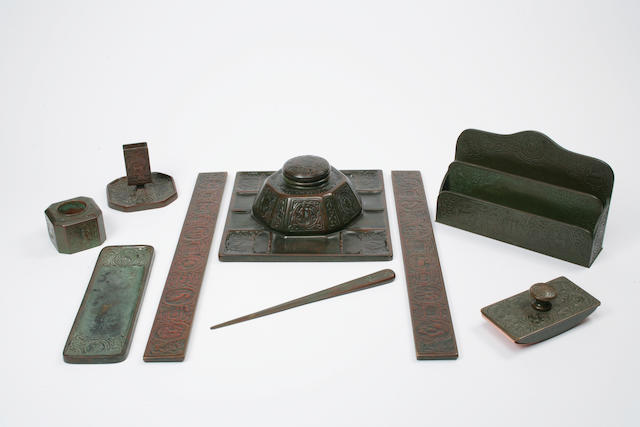 A Tiffany Studios patinated-bronze eighteen-piece Zodiac desk set