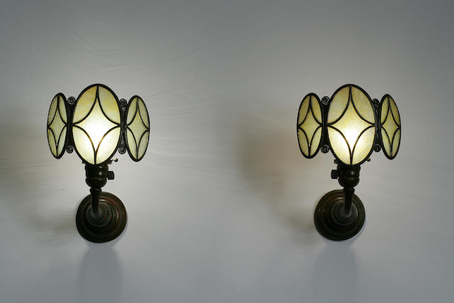 A good pair of Tiffany Studios Favrile glass and bronze shield sconces