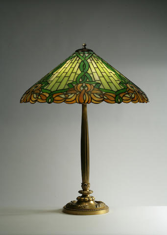 A Duffner and Kimberly leaded glass and gilt-bronze lamp