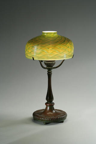 A Tiffany Studios Favrile glass and bronze damascene lamp