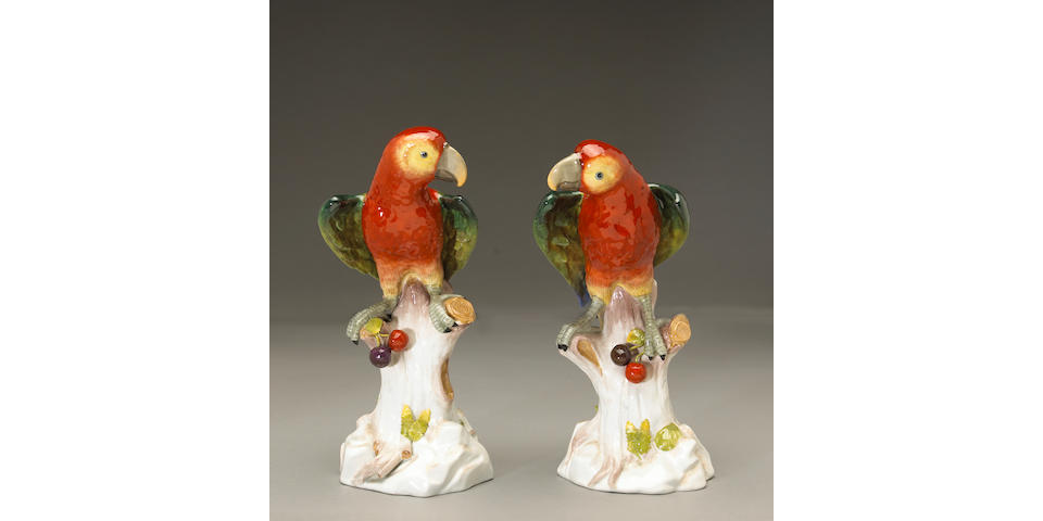 A pair of Dresden porcelain models of parrots