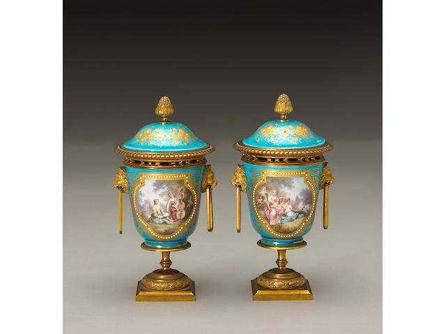 A pair of Napoleon III S&#232;vres style porcelain gilt bronze mounted covered urns