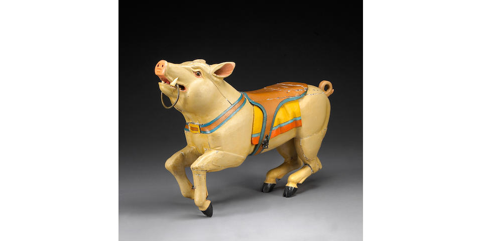 A carved and painted carousel pig