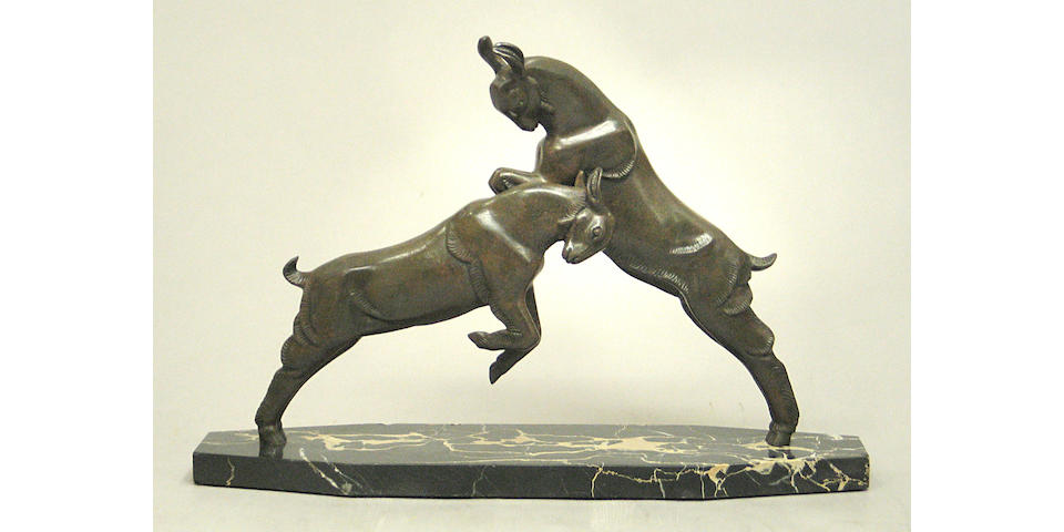 A French Art Deco patinated bronze study of goats