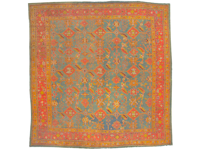 An Oushak carpet West Anatolia, size approximately 13ft. 6in. x 14ft.