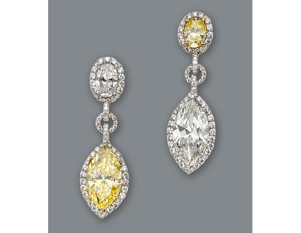 A pair of colored diamond earclips