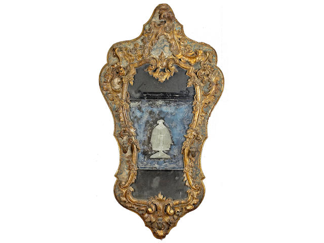 An important Italian Baroque parcel gilt and painted etched mirror