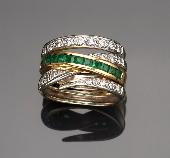 A diamond and emerald ring