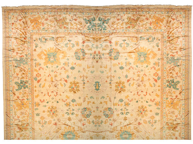 An Oushak carpet West Anatolia, size approximately 19ft. 7in. x 39ft. 5in.
