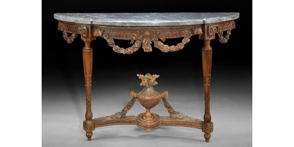 A Louis XVI carved oak console table
