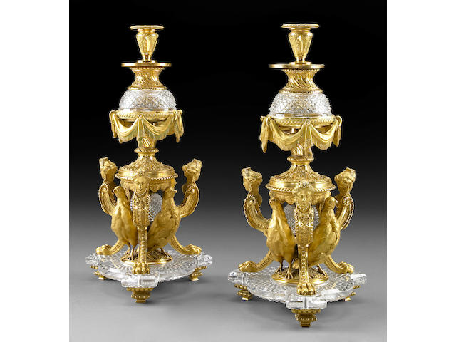 A pair of Louis XVI style cut crystal and gilt bronze candlesticks