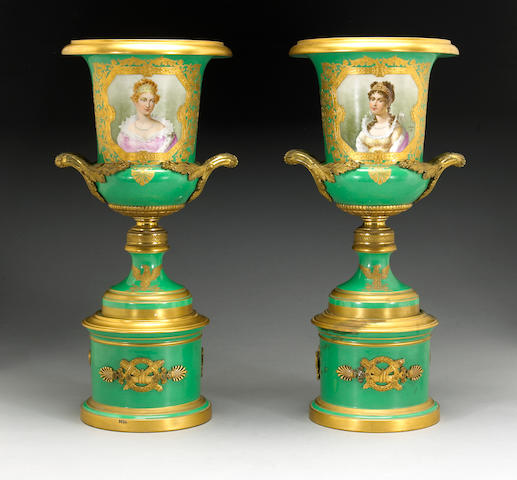 A pair of S&#232;vres style gilt bronze mounted porcelain urns