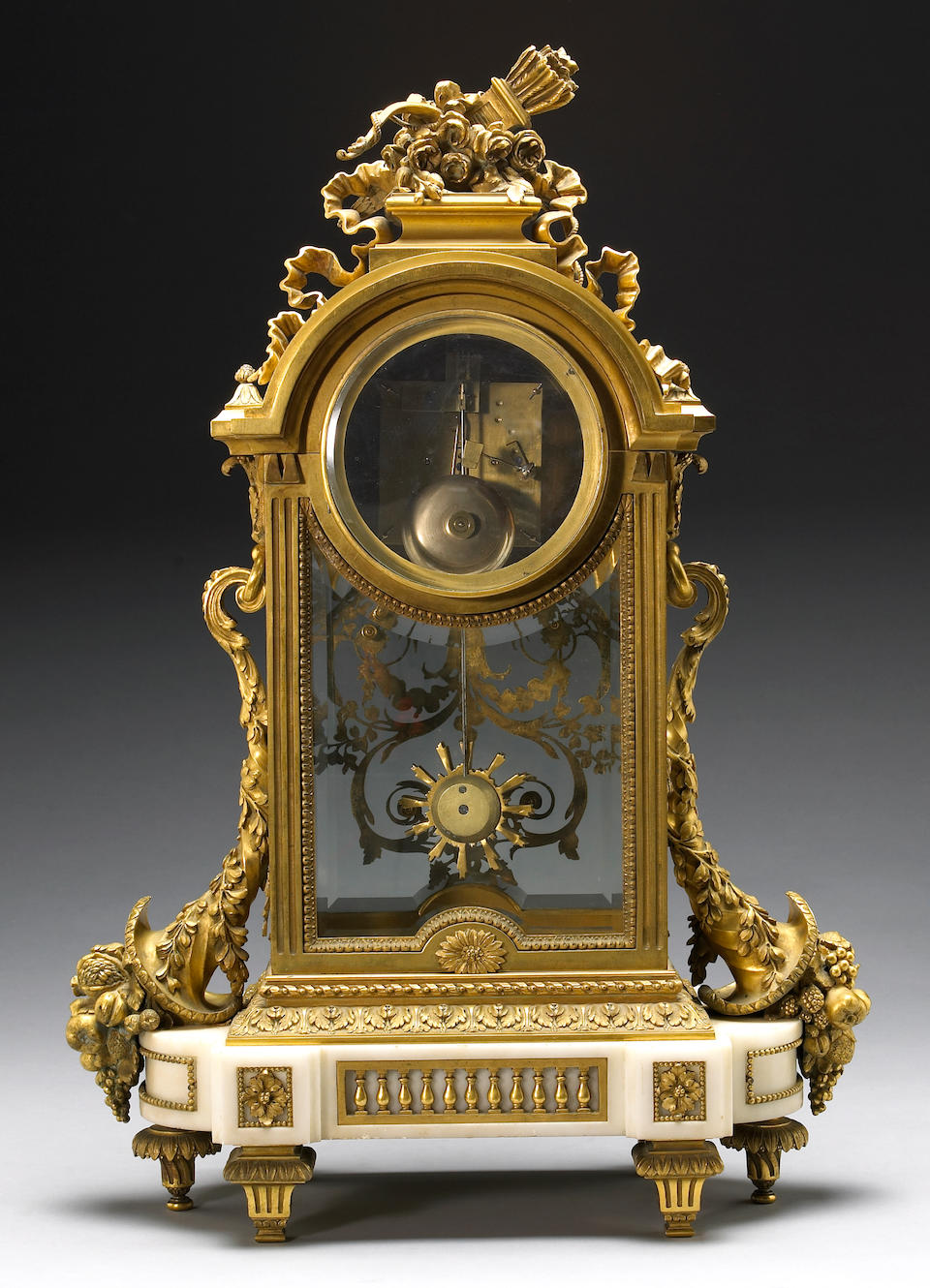 A very fine Louis XVI style gilt bronze and marble three piece clock garniture