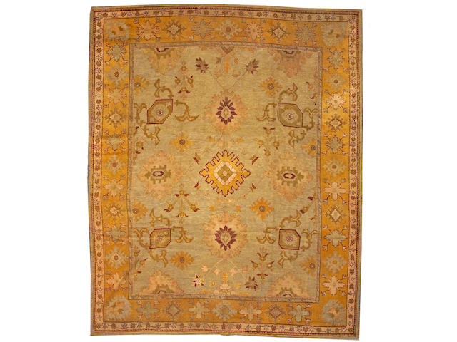An Oushak carpet West Anatolia, size approximately 11ft. 2in. x 13ft. 7in.