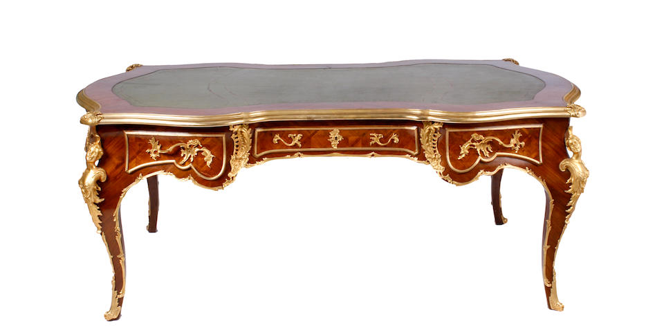 A Louis XV style gilt bronze mounted bureau plat