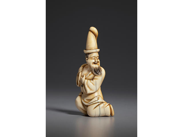 Ivory netsuke of a blind foreigner Late 18th century