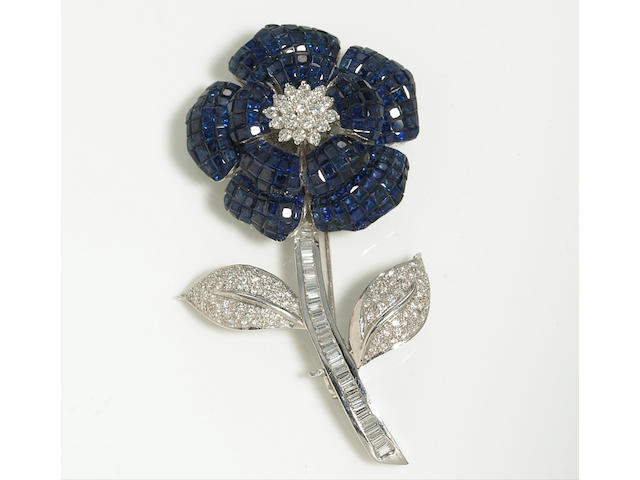A sapphire and diamond flower brooch