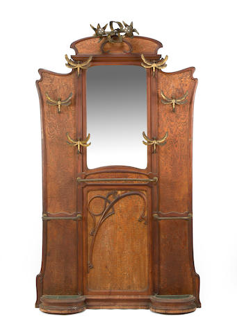 An Art Nouveau walnut and patinated metal hall stand