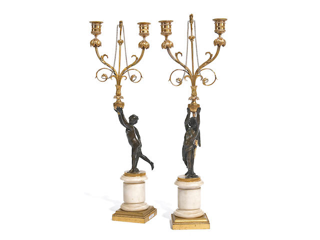 A pair of Louis XVI style gilt, patinated bronze and marble figural two light candelabra 19th century