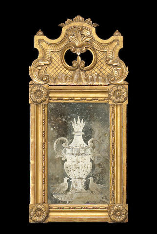 A Louis XVI style engraved giltwood mirror