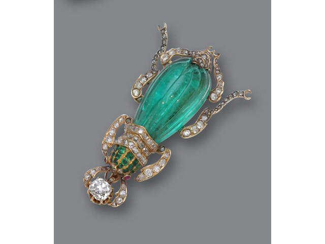 An emerald, diamond and ruby brooch