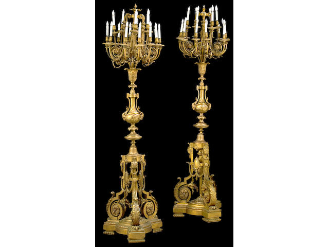 A good and imposing pair of  R&#233;gence style gilt bronze eighteen light floor lamps  circa 1900