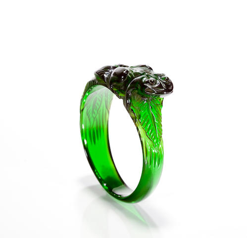 A translucent green Bakelite carved bangle bracelet
