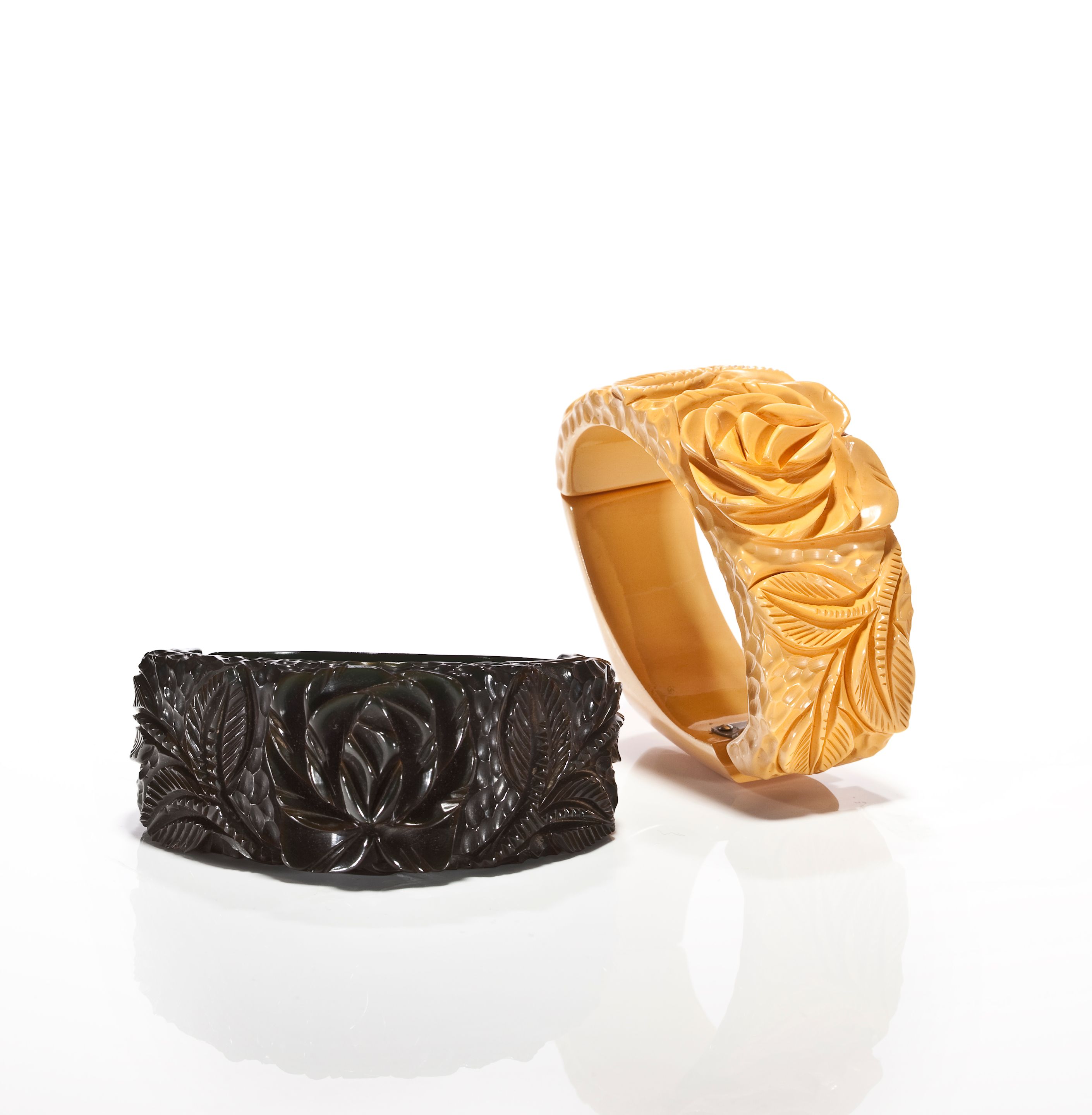 Two Bakelite carved hinged bangle bracelets