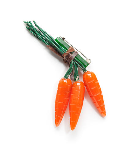 A Bakelite carrot brooch
