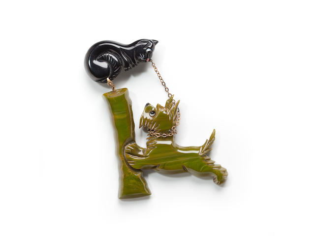 A Bakelite cat and dog brooch